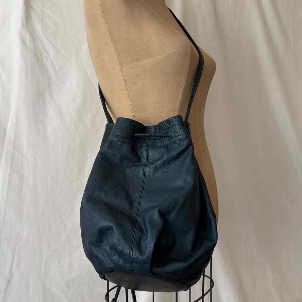 Brio Dark Navy Leather Bucket Bag with adjustable strap.